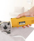 Heavy Duty Electric Rotary Fabric Carpet Cutter With 70mm Octagonal Blade cutting through fabric for precise textile trimming.