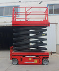 Heavy Duty Mobile Scissor Lift Pumping Smooth Hydraulic Power And Roomy Anti Slip Platform For Grunt Work Job Sites And Facility Pros Demanding Zero Drama Elevated Access Day After Day with red frame and steel chassis.