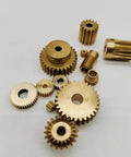 Assorted brass gears including Bevel Gear Set 69 Tooth Brass Gear 0.5 Mod With Step Teeth 6.35mm Bore 15mm Step Diameter 35.5mm Outer Diameter.