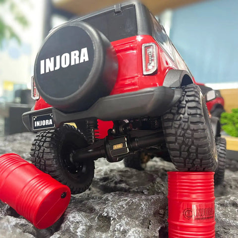 Rear view of TRX4M crawler with Brass Front And Rear Axle Diff Covers With Black Hard Coating For TRX4M 1 18 Crawler Upgrade Parts