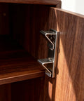 Close-up of Heavy Hitter 18 Piece Silver Steel Shelf Clip Kit, showcasing a bracket mounted for stable wooden shelf support.