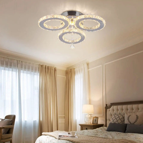 LED Crystal Pendant Ceiling Light With 3 Rings Cool Sleek Chandelier Flush Mount in bedroom with warm lighting