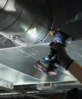 Worker using Two In One Cordless Impact Driver And Wrench 18V Connected Ready For One Fourth Inch And One Half Inch Bits And Sockets