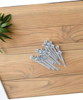 Heavy Duty Lawn Aerator Shoes With Spikes Set Of 12 Workhorse Footwear spikes shown on wooden surface