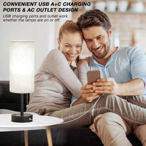 Couple using phone with Bedroom Lamps Set Of 2 With 3 Color Modes And USB C And USB A Charging Ports, lamp on table charging device.