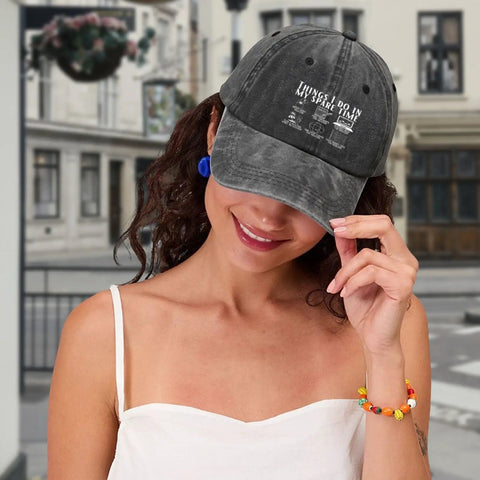 Woman wearing Funny RV Caravan Lover Travel Cap Lightweight Soft Cotton Baseball Hat, black trucker style, smiling outdoors.