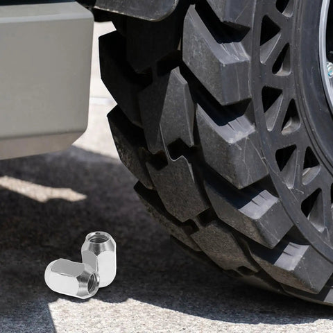 Top Tier MERRYHAPY 16 Piece Acorn Style ATV Wheel Nut Kit For Quad Dirt Bike Trailers With Heavy Duty Metal Construction Ensuring Ultimate Durability And Super Easy Installation For Your Off Road Adventures silver wheel nuts shown by ATV tire