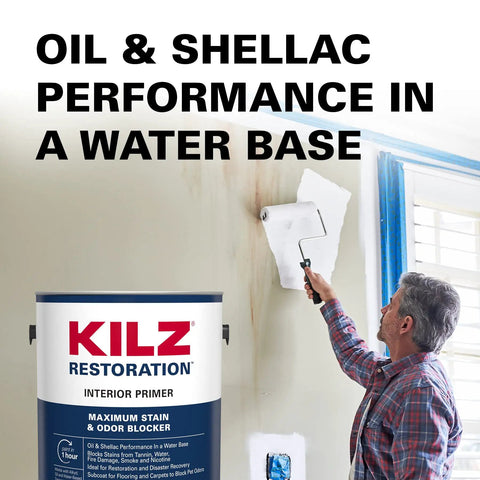 Man applying Restoration Primer Interior Sealer And Stainblocker, Water Based, on wall for superior adhesion and odor blocking.