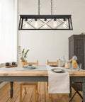 Five Light Dining Room Chandelier In Black And Brush Gold Finish above dining table, kitchen setting with chairs and cabinet.