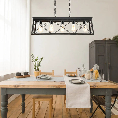 Five Light Dining Room Chandelier In Black And Brush Gold Finish above dining table, kitchen setting with chairs and cabinet.