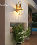 Retro Copper Wall Sconce Top Shelf All Metal Casting Dry Rated For Bedrooms Hallways And Porches on outdoor wall with warm glow.