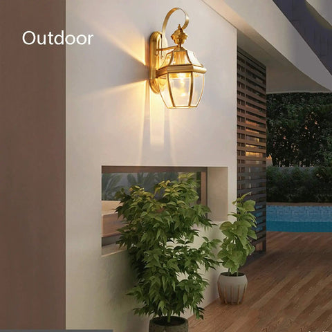 Retro Copper Wall Sconce Top Shelf All Metal Casting Dry Rated For Bedrooms Hallways And Porches on outdoor wall with warm glow.