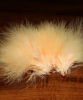 Marabou Blood Quills For Fly Tying, Long Flowing Marabou Feathers In Southern Fl Peach on dark wood surface