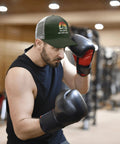Man boxing in gym wearing Women's Lightweight Summer Trucker Cap Army Green Dope Everyday Wear Cotton Baseball Hat with Mesh Back