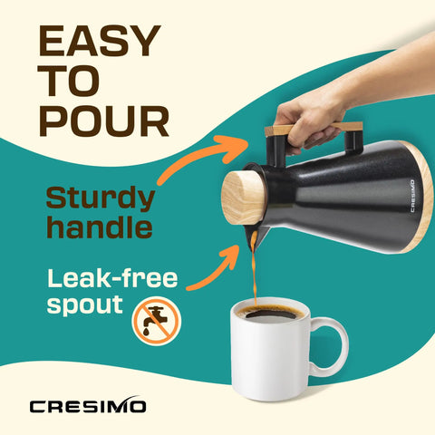 Pouring coffee from Vacuum Insulated Thermal Carafe 34 Oz Keeps Coffee Hot for 12 Hours with Glass Wall and Beech Wood Accents