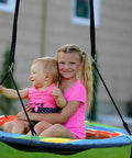 Children enjoying Giant 40 Inch Saucer Tree Swing With Heavy Duty 1680D Oxford Fabric, 700 Lb Weight Capacity, outdoors