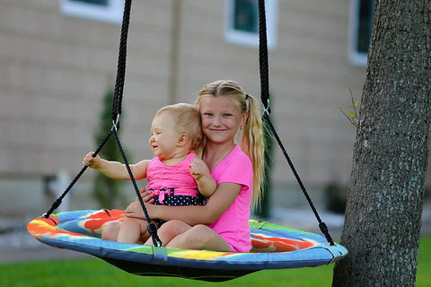 Children enjoying Giant 40 Inch Saucer Tree Swing With Heavy Duty 1680D Oxford Fabric, 700 Lb Weight Capacity, outdoors