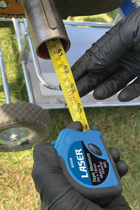 Measuring pipe length with tape measure from Karting Tool Kit 36 Piece With Three Eighths Inch Drive Ratchet, Sockets, Extensions, Pliers