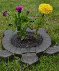 Turtle Stepping Stone Mold for Concrete Pathways 17.3 by 15 by 1.6 Inch Cement Mold used as garden decoration with flowers.