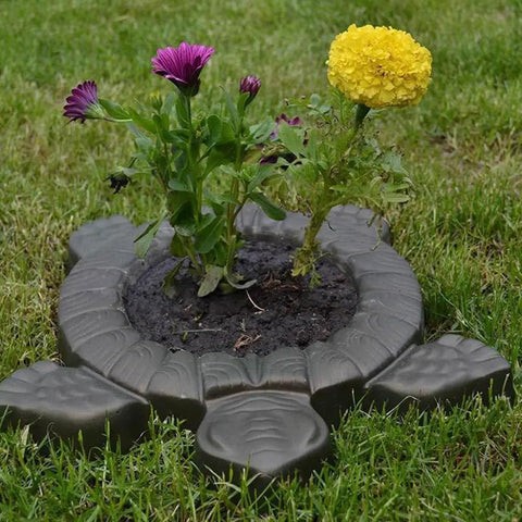 Turtle Stepping Stone Mold for Concrete Pathways 17.3 by 15 by 1.6 Inch Cement Mold used as garden decoration with flowers.