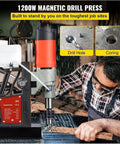Heavy Duty 1100W Magnetic Drill Press For Metal, Portable Benchtop Coring Machine with operator using it on steel.