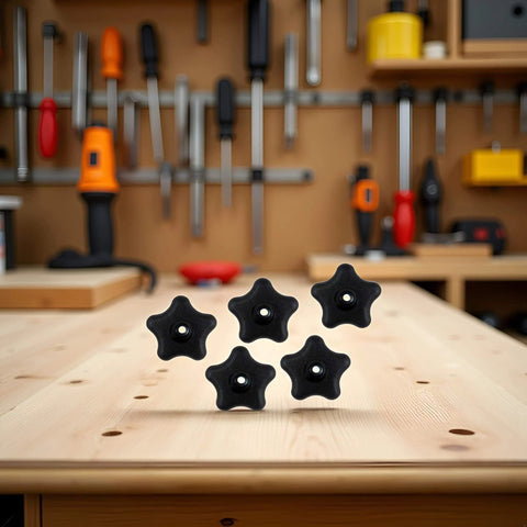 Five Pack Black Star Knobs For T Track Bolts And Feather Boards, 5/16-18 Female Thread, on a wooden workbench.