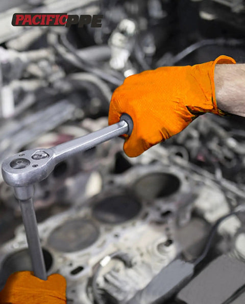 Extra Thick 8 Mil Orange Nitrile Work Gloves Heavy Duty Disposable Knit Cuff For Mechanics And Tradesmen Bulk 100 Pack gripping a ratchet in an automotive setting.