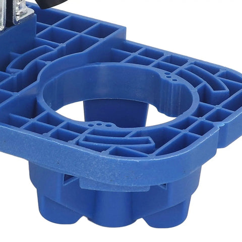 Close-up of Precision Hinge Opening Locator 35mm Drill Guide, blue plastic base for woodworking door hole placement.
