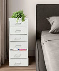 Heavy Duty Six Drawer Metal File Cabinet With Smooth Ball Bearings Slick White Rolling Filing Cabinet For Home Office beside a bed.
