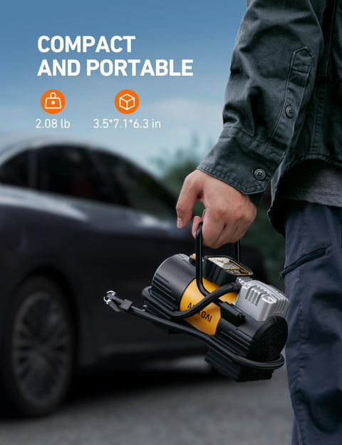 Person holding Portable Tire Inflator Air Compressor For Car And Bike 12V DC Digital Gauge Up To 150 PSI with LED lights