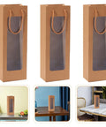 Kraft Paper Wine Bags With Window And Handles 24 Pack shown with clear window and rope handles on tables
