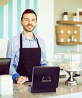 Barista with a Beefy Locking Cash Box With Money Tray For Cash Registers on countertop in a café setting.