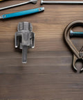 Kick Plumbing Hassles To The Curb With This Badass ABOOFAN 3 Pc Pipe Threader Tool Kit, heavy-duty steel cutter on wooden surface.