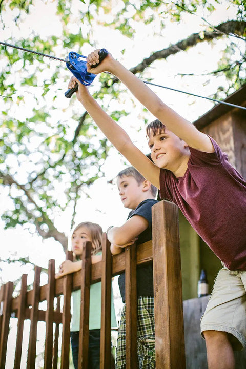Children using 200 Ft Zip Line Kit With Adjustable Harness And Bungee Brake System For Backyard Fun, heavy duty cable, outdoors
