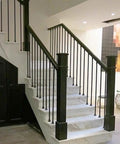 Heavy Duty Square Black Iron Railing Spindles Featuring Kickass Durability And No Sweat Installation For Classic Modern Home Decor Throughout Any Property on a staircase.