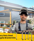 Man holding tools near a partially constructed pergola with heavy duty steel pegs for 5 Way Right Corner Pegola Bracket Kit For 4x4 Lumber Diy Gazebo Pergola Construction With Hardware Heavy Duty 14 Gauge Steel Corner Brackets For Patio Outdoor Projects Log Cabin 1 Pack in background