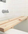 Hinoki Tub Bench Small For Bathroom Must Have, Water Ready Bath Stool Made From Japanese Cypress Hinoki Wood spans a white bathtub.