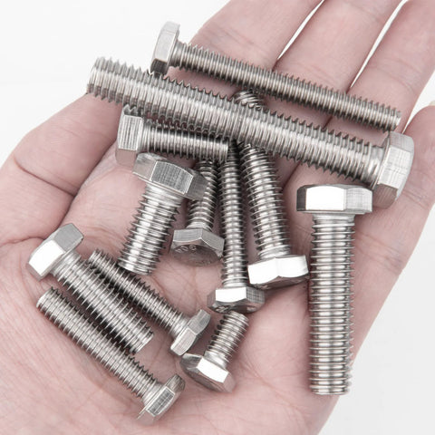 Stainless steel hex bolts with nuts held in hand; assorted lengths.