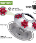 Close-up of the Hand Blown Glass Hummingbird Feeder With Ant Moat And Bee Proof Ports For Outdoor Hanging Leak Proof design.