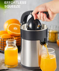 Ditch the Squeeze Work! This Electric Citrus Juicer with two cones extracts orange juice into a glass, showcasing its design.