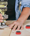 Woodworker using tools with 12 Pack Three Quarter Inch Bench Dogs For Woodworking Red Dog Hole Clamps For Tight Boards in view.