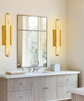 Set Of Two 25 Inch Brass And Natural Alabaster Wall Sconces Featuring Authentic Spanish Marble Veins For Bathroom Bedroom Or Hallway Total Game Changer Lighting in elegant bathroom setting.