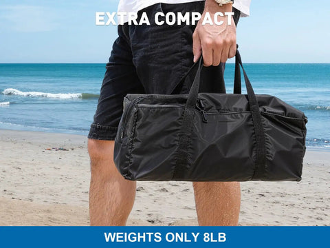 Person holding black bag for Massive 14 Ft By 11 Ft Beach Shade Canopy With Eight Sandbags, Upf 50+ Sun Shelter at the beach