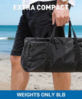 Roomy Fourteen By Eleven Foot Beach Sun Shelter With UPF50 Plus Protection packed in compact black bag on a beach