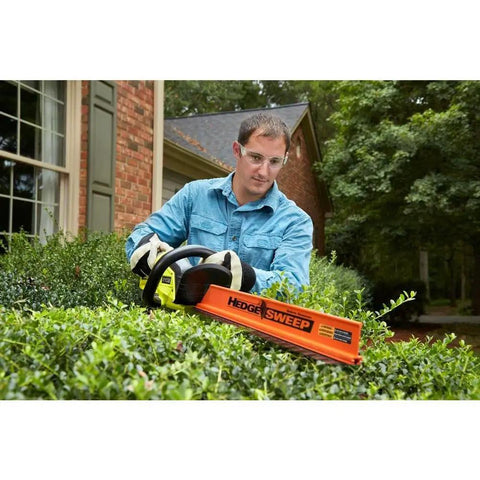 Man using 22 Inch Cordless Hedge Trimmer With 18 Volt Power Delivers Beast Mode Performance In A Lightweight Easy To Maneuver Package