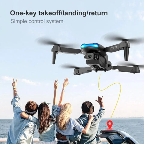 Foldable Camera Drone With Remote For Beginners flying over a group near ocean, featuring one-key takeoff and landing