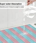 Water poured on Pink Green Wood Grain Print Dish Drying Mat For Kitchen Counter, Must Have Ultra Absorbent Microfiber Drying Pad, Machine Washable, 16 By 18 Inch Rack Mat For Countertop And Dishes, Quick Dry And Non Slip, showing absorption power