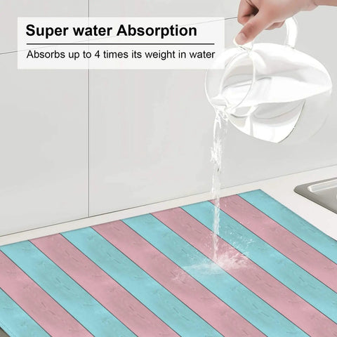 Water poured on Pink Green Wood Grain Print Dish Drying Mat For Kitchen Counter, Must Have Ultra Absorbent Microfiber Drying Pad, Machine Washable, 16 By 18 Inch Rack Mat For Countertop And Dishes, Quick Dry And Non Slip, showing absorption power