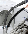 Dryer Vent Cleaning Kit With Vacuum Hose Attachment And Lint Brush showing use in lint removal from dryer