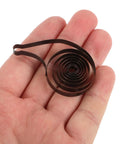 Mechanical Clock Spring For Alarm Clocks DIY Repairs And Craft Projects Replacement Component in hand